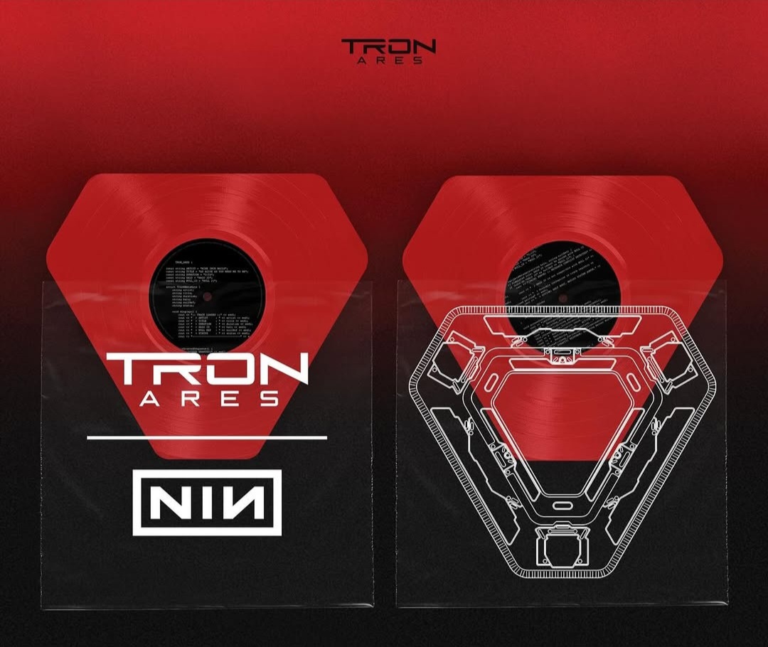 red	San Diego Comic Con Exclusive 7 inch vinyl shaped in a Tron truncated triangle shape in a clear sleeve with circutry printed on it