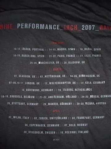 the back of a nine inch nails tour shirt displaying the tour dates. Certain letters are bolder than the others